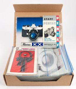 ASAHI KOGAKU: One A4 archive box containing seventy Asahi Kogaku product brochures, sales guides, and instruction booklets, each sealed in a plastic sleeve. (70 items)