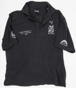 NTFL representative side 1992. Team polo worn by Nathan Buckley around the 1992 game v Geelong. Black with NTFL logo on left breast, CUB logo on sleeves and ‘NTFL v Geelong 1992 Representative’ on right breast. 2 items. - 3