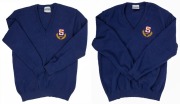 Nathan Buckley’s blue SANFL sweater with SANFL crest on left breast. Part of the SANFL team outfit for the 1992 game against the WAFL. (2 examples in different sizes).