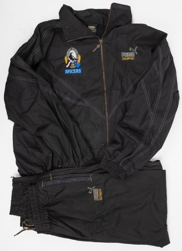 Nathan Buckley’s Collingwood players’ track suit (jacket with matching pants). Mid-1990s. Black Puma King tracksuit with Collingwood logo and blue Spicers patch underneath.