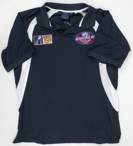 Australian Football International Cup series, 2008 official polo shirt. This was an international Australian football competition played between 16 nations in 2008, as part of the 150th year celebrations of Australian Rules football. Also, an Australian f