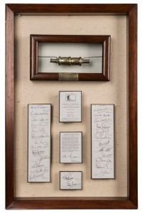 Limited edition silver gilt cricket bail containing a scroll of honour created to commemorate the Centenary Jubilee test match at Lords, June 1977; the scroll bearing the replica signatures of the Australian and English teams. Attractively presented in timber frame. 48 x 31cm overall.