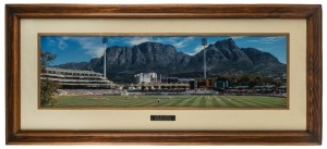 "OUT OF AFRICA" magnificent panoramic photograph with engraved plaque '2nd Test Australia v South Africa. Newlands Stadium, Capetown 2002.' Attractively framed & glazed, overall 57 x 128cm. Australia won this Test Match by 4 wickets. Justin Langer received an award for his 50th Test; Shane Warne, who took 6 wickets in the 2nd innings, received an award for his 100th Test.