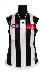 Nathan Buckley’s 2003 home-and-away season match-worn guernsey. This was a stellar season in Buckley’s glittering career as he not only captured another Copeland Trophy but also shared the Brownlow medal with Adelaide’s Mark Ricciuto and Sydney’s Adam Goodes. He was also named all-Australian for the seventh time, and was named by the Coaches Association as their champion player of the season.