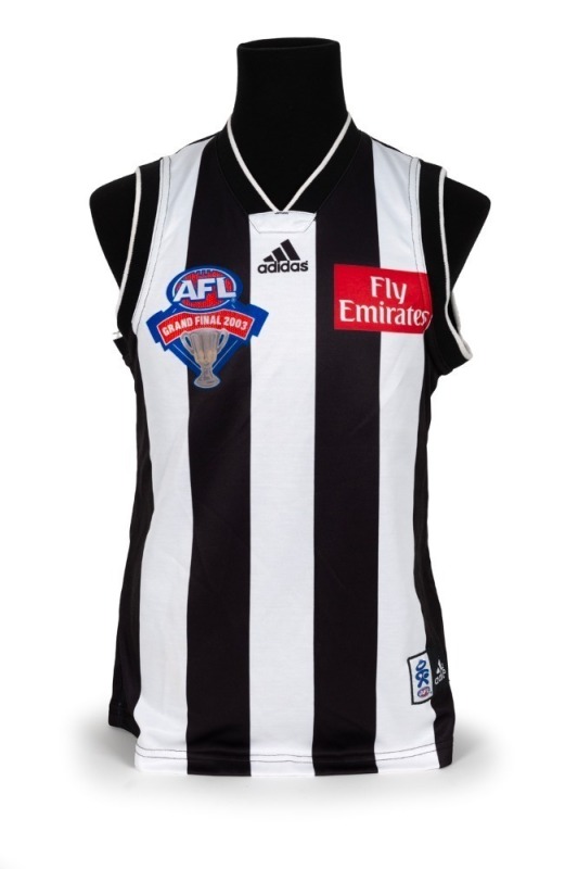 Nathan Buckley’s 2003 Grand Final guernsey. The Magpies went into the Grand Final with high hopes that they could atone for the previous year’s loss, but it was a dirty day for the black-and-white army as the team lost by 50 points. This is the jumper Buc