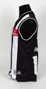 Nathan Buckley’s 2003 Grand Final guernsey. The Magpies went into the Grand Final with high hopes that they could atone for the previous year’s loss, but it was a dirty day for the black-and-white army as the team lost by 50 points. This is the jumper Buc - 3