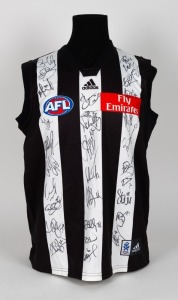 Collingwood guernsey 2007, signed by all the players. No number, but with all relevant branding and logos.