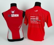 Channel 7 branded 2XU sleeveless running shirt worn by Nathan Buckley when competing in the BRW Triathlon series in 2009. Bright red with Channel 7 logo on front and &lsquo;Go Seven&rsquo; on the back. Together with red T-shirt given to Buckley for finishing the even - 2