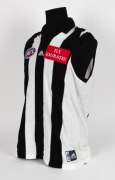 Nathan Buckley&rsquo;s Collingwood guernsey 2000. Home guernsey&nbsp;made by Adidas ("XX Large"), with AFL Emirates and adidas branding in addition to a combined label sewn on at lower left. Match worn by Buckley during the season. Unframed. - 2