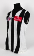 Nathan Buckley’s Collingwood guernsey 2000. Home guernsey made by Sekem ("To fit chest 115cm"), with AFL, adidas and Emirates branding. Match worn by Buckley during the 2000 season. Unframed. - 2