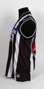 Nathan Buckley&rsquo;s Collingwood guernsey 2000. Away guernsey&nbsp;made by adidas ("X LARGE") match worn by Buckley during the 2000 season, with Magpie in oval on front, blue Primus logo on front and &lsquo;shield&rsquo; style number / Emirates patch on rear. Also with adidas - 3