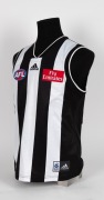 Nathan Buckley’s 2001 guernsey. Home guernsey made by adidas, with their label and AFL and Emirates branding; match worn by Buckley during the 2001 season. Unframed. - 2