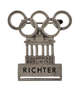1936 BERLIN OLYMPICS Referee or Judge's Badge in silvered bronze, 45 x 42cm, made by L. Chr. Lauer, Nurnberg-Berlin and designed by Walter Raemisch; inscribed RICHTER, numbered "156" on reverse, with clip mechanism intact. Lacks ribbon.The design combines the Olympic Rings with the Brandenburg Gate, the landmark of Berlin.