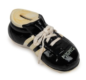 COLLINGWOOD: A black & white "MAGPIES" ceramic shoe-shaped money box; with original label to sole "Authorised by Adidas, owner of the 3-stripe trade mark.." Very rare.