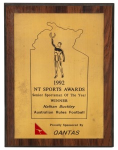 Northern Territory Sports Awards, 1992. Wooden plaque with metal plate, awarded to Nathan Buckley as ‘Senior Sportsman of the Year’. Together with a similar framed plaque with engraved "Certificate for Outstanding Achievements Awarded to Nathan Buckley Au