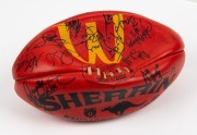 100th GAME FOOTBALL: A red Sherrin football with yellow McDonald’s logo, signed by Nathan Buckley and other players including Josh Mahoney, Brad Cassidy, Andrew Schauble, Jason Wild, Scott Russell, Simon Prestigiacomo, Paul Williams and others. Note: the - 4