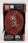 A Wilson NFL football signed by champion running back Marcus Allen. Allen spent 16 years in the NFL, mostly with the LA Raiders, winning a Super Bowl in 1984 and being named MVP in that game.