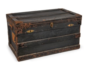 CLARRIE GRIMMETT'S large travelling trunk used to transport his cricket equipment, boots and clothing; with painted "C.V. GRIMMETT" to the top and with large (part) paper label on side panel headed "AUSTRALIAN CRICKET XI, ENGLISH TOUR 1934" with Grimmett's name added in pen. Overall 50cm high, 92cm wide, 53.5cm deep.