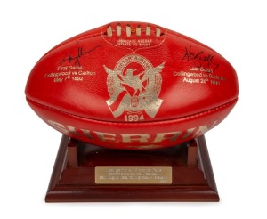 Last game at Victoria Park, v Brisbane, 28 August 1999: souvenir football with gold writing, signed by Nathan Buckley (captain) and Tony Shaw (coach). Only 108 of these were produced, and each one is numbered with one of the 108 years in which Victoria Park had been Collingwood’s home ground. This football is number 1994 – the year of Buckley’s Collingwood debut. Sits on a wooden stand, with details and ball number engraved on a metal plate.