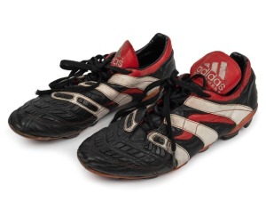 Nathan Buckley’s match worn boots circa 2000. Adidas boots with ‘5’ handwritten on back of boot (this was usually done by club bootstudders so they could easily keep track of which boots belonged to particular players). Black with red piping and white stripes. ‘Adidas Equipment’ printed in white on back of boot, and also on tongue.