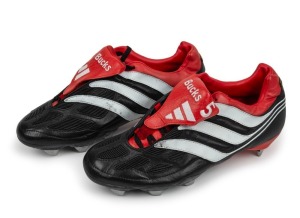 Pair of boots presented to Nathan Buckley by adidas in the early 2000s. The adidas boots with ‘Bucks 5’ sewn in white on the red leather tongues, black with red piping and white stripes. Interestingly, Buckley didn’t like the personalisation and it is unlikely the boots were ever worn in matches. Unique.