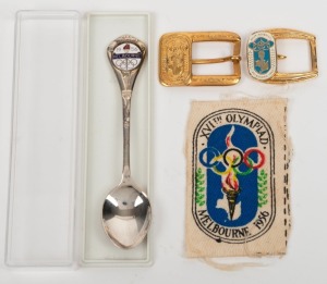 1956 MELBOURNE OLYMPICS: Small group comprising of two rare "AROS" brand belt buckles which incorporate the official Melbourne 1956 logo, a fabric patch with the logo and a souvenir teaspoon by Stokes. (4 items).