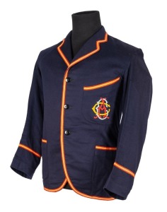 ADELAIDE CRICKET CLUB BLAZER, Grimmett's Adelaide Cricket Club blazer, blue wool with yellow and red trim, with monogram initials of the A.C.C. embroidered in red, yellow, and turquoise thread; label of McCarron & Co., inscribed in ink "MR. C.V. GRIMMETT 