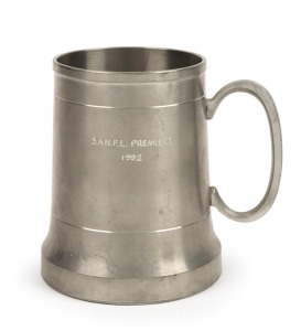 Pewter tankard presented to Nathan Buckley for being part of Port Adelaide Premiership side. Engraved ‘SANFL Premiers 1992’. West End logo on reverse.