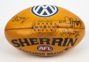 BUCKLEY'S 200th GAME: The football, a yellow/tan Sherrin with VW branding, signed by the three umpires #29 (Scott Jeffrey), 23 (Martin Ellis) and #5 (Matt James) who officiated during Buckley’s 200th career game v Carlton in 2002. - 2