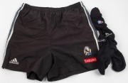 Nathan Buckley’s Collingwood game socks and training shorts, early 2000s. The socks with AFL logo at top with ‘CFC’ and ‘adidas’ lower down. The shorts with adidas, Emirates and CFC branding. (3 items).