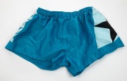 Nathan Buckley&rsquo;s Allies match worn playing shorts from 1995. Bright blue with black star in white patch on one side, and &lsquo;Allies&rsquo; down the other side.