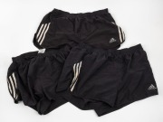 Group of general training shorts worn by Nathan Buckley during his playing days at Collingwood. All&nbsp;adidas and black with white stripes. (3 pairs).