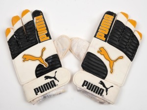 A pair of Puma gloves. Trialled by Nathan Buckley during training, but never worn during a match.