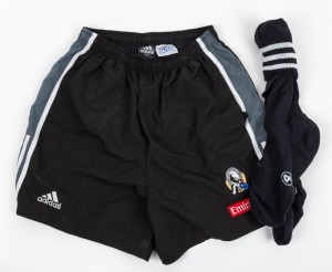Nathan Buckley's Collingwood training shorts by adidas with AFL logo label; together with a pair of adidas black & white long socks. (3 items).