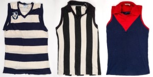 Group of three football jumpers acquired by Nathan Buckley during his football career. One is an older Collingwood-style guernsey without number or other identifying patches. The second is a Melbourne/Norwood style Brandella brand jumper bearing #51, but with no sponsor or League patches. The third is a Geelong style #5 guernsey with VFL logo, made by Sekem. Origins of all three unknown. (3).