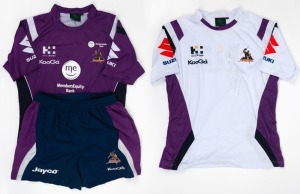 Two different Melbourne Storm guernseys and a pair of Storm shorts, given to Nathan Buckley by the Melbourne Storm team. (3 items).