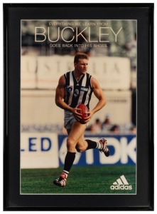 A framed advertisement for adidas boots featuring an action shot of Nathan Buckley c1999, with the words ‘Everything we learn from Buckley goes back into his shoes’. Plus a print advertisement for Puma boots and Rebel Sports featuring a close-up of Nathan Buckley and Jason Dunstall facing each other, and the heading ‘Some Things They Do See Eye to Eye On’. (2 items).