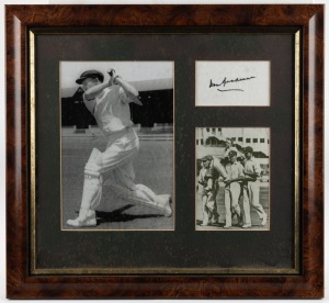 DON BRADMAN: a framed and glazed display featuring a Don Bradman autograph, along with two photos, one of Bradman driving and the other of him being carried off at the end of a record innings.