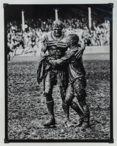 NORM PROVAN and ARTHUR SUMMONS, original signatures on a large format print of the iconic photograph by John O'Gready, known as "The Gladiators"; overall 43 x 34cm.