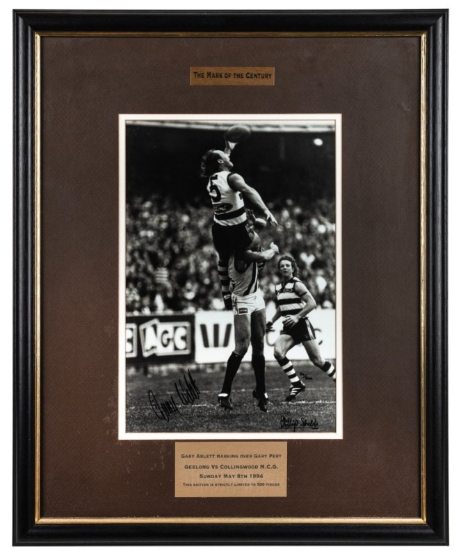 Gary Ablett Sr. marking over Gary Pert, Geelong Vs Collingwood at the MCG, May 8 1994; signed by both players; attractively framed & glazed. Numbered 30/500. Overall 58 x 47cm.