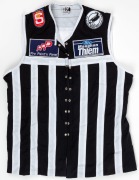 2001 Port Adelaide guernsey, #34. Lace-up guernsey bearing Buckley&rsquo;s old #34, given to him as a souvenir upon his return to the club for a visit, most likely the 1992 Premiership 10-year reunion. Maughan Thiem Ford and Pro Paint n Panel sponsor patches on