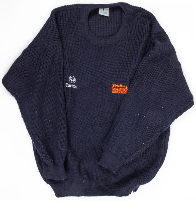 Nathan Buckley’s Brisbane Bears team sweater. Navy-blue woollen sweater made by Fashion Clubwear in Melbourne. Bears logo on left breast, CUB logo on right. Worn by Buckley during the 1993 season.