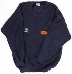 Nathan Buckley’s Brisbane Bears team sweater. Navy-blue woollen sweater made by Fashion Clubwear in Melbourne. Bears logo on left breast, CUB logo on right. Worn by Buckley during the 1993 season.