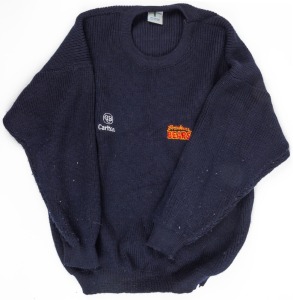 Nathan Buckley’s Brisbane Bears team sweater. Navy-blue woollen sweater made by Fashion Clubwear in Melbourne. Bears logo on left breast, CUB logo on right. Worn by Buckley during the 1993 season.
