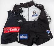 Nathan Buckley's Collingwood player's jacket circa 1998; together with a pair of Collingwood team playing shorts circa 1999 and a black training singlet circa 1999. All three items used by Nathan Buckley. (3).