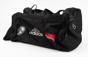 Nathan Buckley’s Collingwood kitbag circa 2000. Large adidas black kitbag with the number ‘5’ written on both ends. Collingwood logo, adidas and Fly Emirates badging along one side.