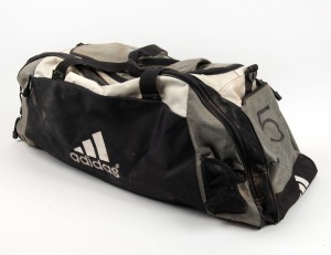 Nathan Buckley’s Collingwood kitbag, early 2000s. Large adidas black, grey and white kitbag with the number ‘5’ written on both ends.