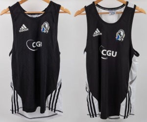 Collingwood training singlets, circa 2010-12. Black fronts with adidas logos top right, CFC logos top left and white CGU logos in middle. The backs are white with Fly Emirates in red lettering. Black stripes on white along sides. Two examples, one XL and 