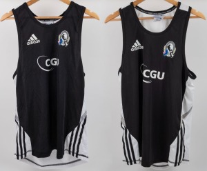 Collingwood training singlets, circa 2010-12. Black fronts with adidas logos top right, CFC logos top left and white CGU logos in middle. The backs are white with Fly Emirates in red lettering. Black stripes on white along sides. Two examples, one XL and one M; both used. (2).
