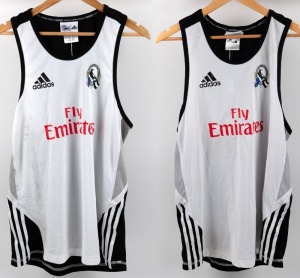 Collingwood training singlets, circa 2010-12. As previous, but with Fly Emirates to front panels and CGU to backs. Sizes XL and M. (2 items).